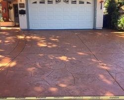 alt="stamped-colored-concrete-driveway-installation-staining-and-sealing."