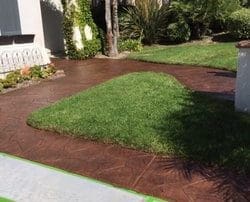 alt="front entrance stamped concrete restoration with staining and sealing"