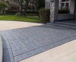 alt="front-entrance stamped-concrete restoration-and-sealing"