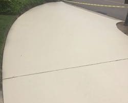 alt="Large concrete driveway installation"