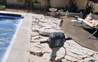 alt="concrete pool deck demolition"