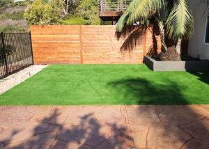 Turf installation fence and stamped concrete