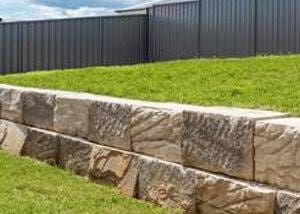 alt="retaining-wall installation"